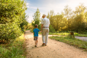 Active Transportation Leads to a Healthy Community - Grandpa and Grandson Walking
